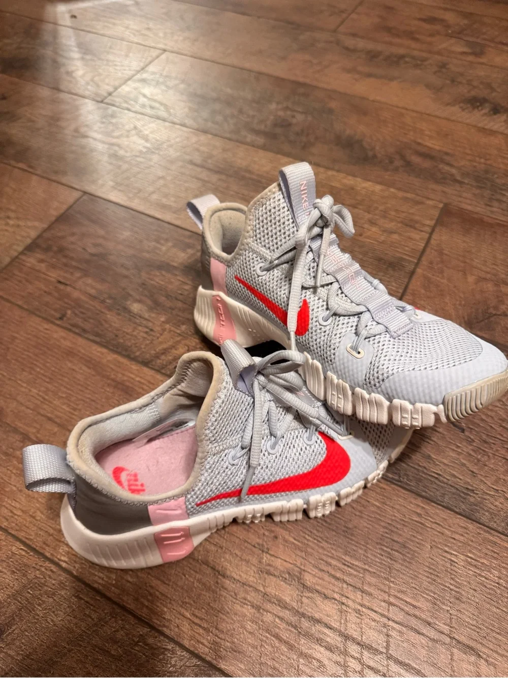 Nike Gray Athletic Sneakers with Bright Red Swoosh and Pink Accents